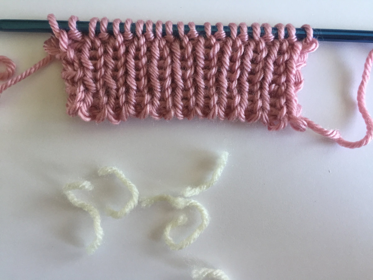 Waste yarn is removed from ribbing edge