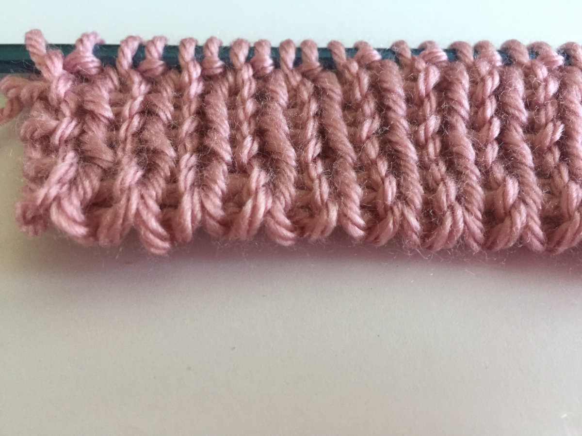 Finished edge of tubular cats on, waste yarn method