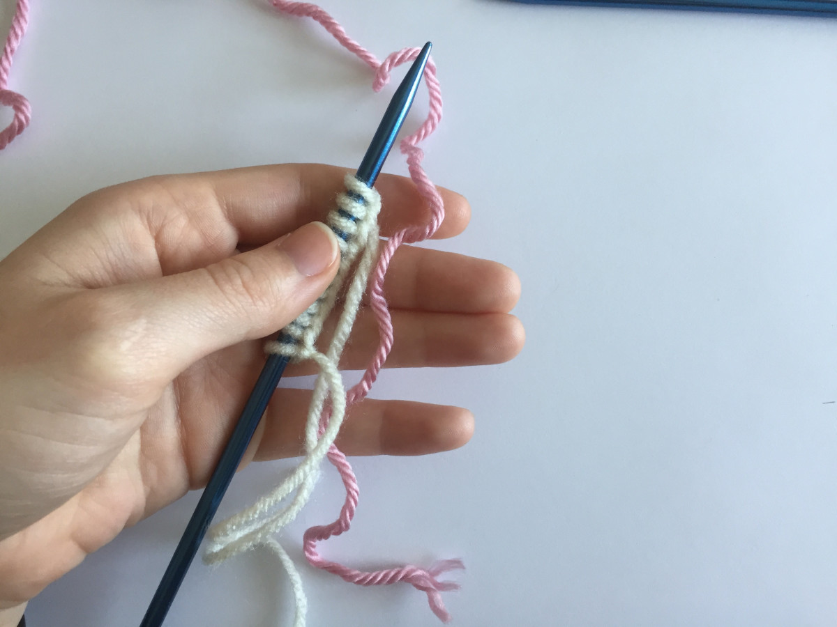 How to hold your yarn while working the tubular cats on, waste yarn method