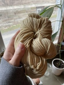 Yellow yarn hand dyed with natural dye made from goldenrod flowers